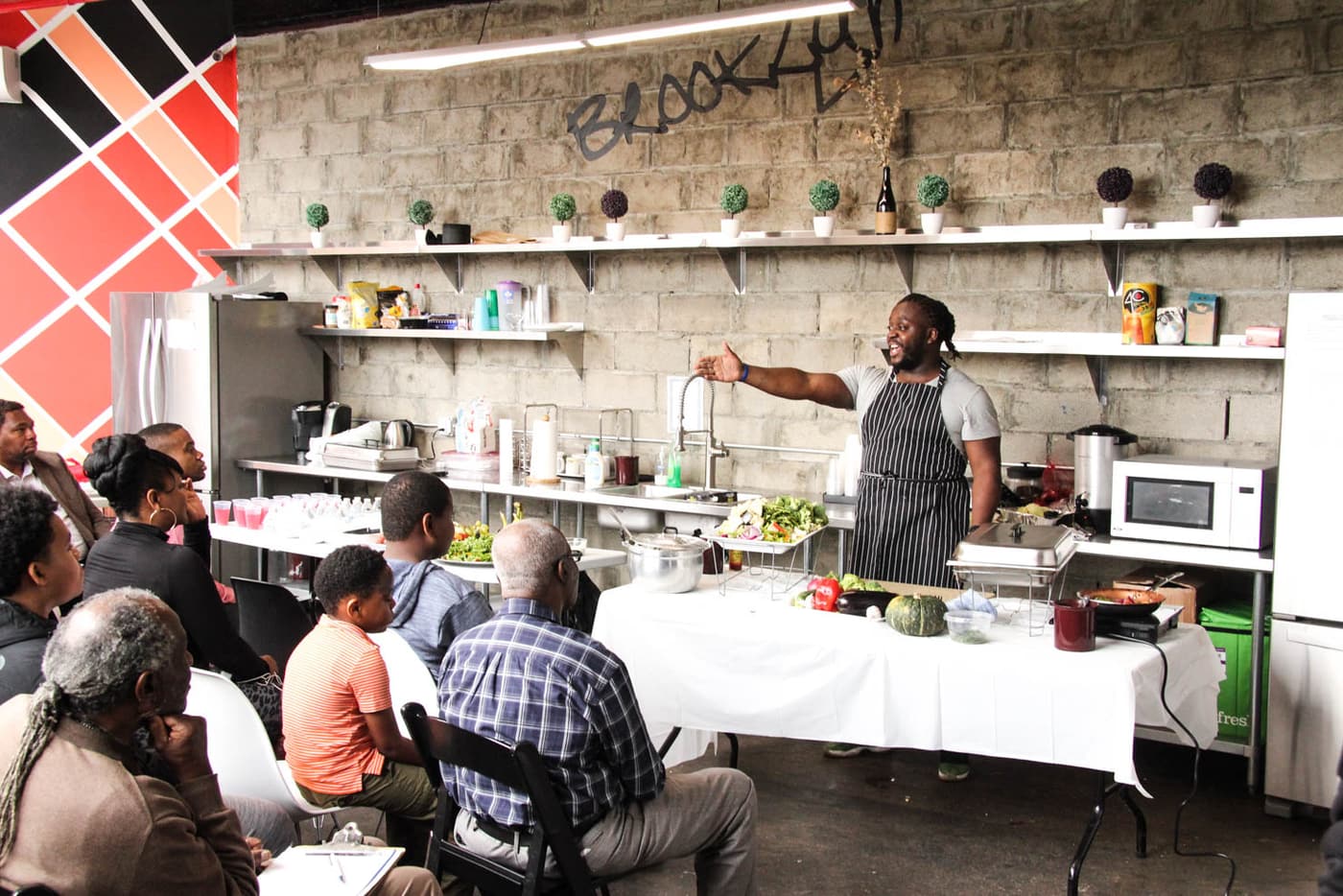 A health and wellness session: a cooking demonstration.