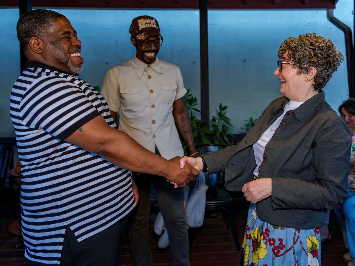 Greeting guests at a community event.
