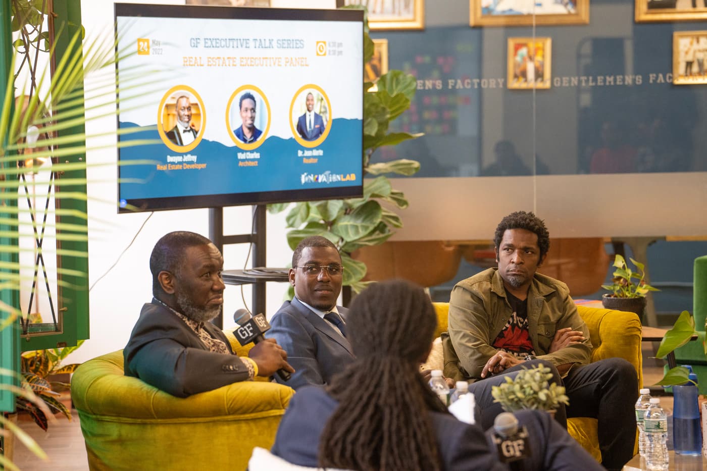A panel discussion with a full audience.